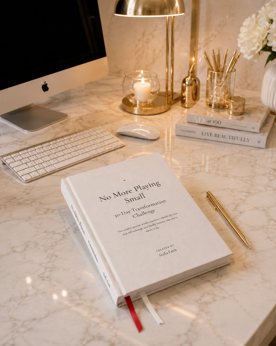 No More Playing Small workbook on a marble desk